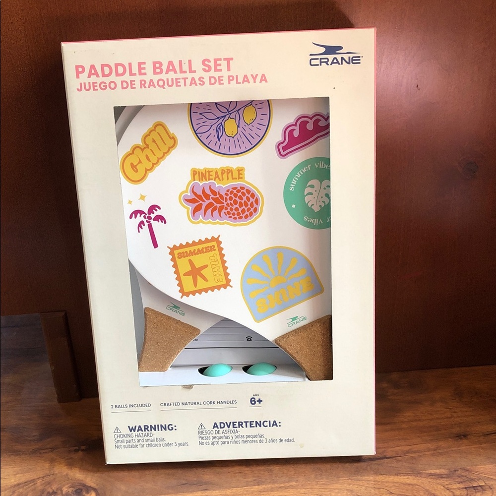 Crane Paddle Ball Set with Pastel Tropical design. Includes 2 balls & 2 paddles